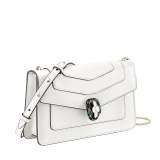 “Serpenti Forever” crossbody bag in agate-white calfskin with Heather Amethyst purple grosgrain inner lining. Iconic snakehead closure in light gold-plated brass embellished with black and agate-white enamel and green malachite eyes 625-CLa image 2