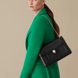 Serpenti Forever medium shoulder bag in black calf leather with emerald green grosgrain lining. Captivating snakehead closure in light gold-plated brass embellished with black and white agate enamel scales and green malachite eyes. 1089-Cla image 4