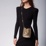 Serpenti Forever mini bucket bag in shiny gold nappa leather with light gold-plated brass metal mesh. Captivating snakehead drawstring and chain strap decors in light gold-plated brass. 291694 image 7