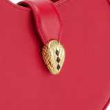 Serpenti Ellipse small crossbody bag in Urban grain and smooth flamingo quartz pink calf leather with flamingo quartz pink gros grain lining. Captivating snakehead closure in gold-plated brass embellished with black onyx scales and red enamel eyes. Online exclusive colour. 1204-Hobo image 6