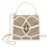 “Serpenti Forever ” crossbody bag in black calf leather and Million Chain motif body and black calf leather sides. Iconic snake head closure in light gold plated brass enriched with black enamel and black onyx eyes. 752-CP image 1