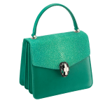 “Serpenti Forever ” crossbody bag in carmine jasper galuchat skin and calf leather. Iconic snakehead closure in light gold plated brass enriched with black and white enamel and green malachite eyes 752-Ga image 2