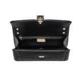 “Serpenti Diamond Blast” shoulder bag in black quilted nappa leather body, featuring a maxi matelassé pattern, and black calf leather frames, with black nappa leather internal lining. Tempting snakehead closure in light gold plated brass enriched with black enamel and black onyx eyes. 922-MFQD image 4