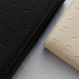 Bvlgari Logo bifold wallet in ivory opal calf leather with hot stamped Infinitum Bvlgari logo pattern and plain black nappa leather lining. Palladium plated brass hardware. BVL-BIFOLDWALLET image 4