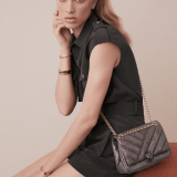 Serpenti Cabochon shoulder bag in soft matelassé charcoal diamond metallic karung skin with graphic motif. Snakehead closure in light gold plated brass decorated with matte black and glitter charcoal diamond enamel, and black onyx eyes. 981-MK image 5