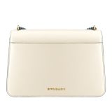 "Serpenti Forever" maxi chain crossbody bag in Ivory Opal white nappa leather, with an Deep Garnet bordeaux nappa leather internal lining. New Serpenti head closure in gold-plated brass, finished with small grey mother-of-pearl scales in the middle, and red enamel eyes. 1138-MCNb image 3