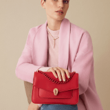 "Serpenti Forever" maxi chain crossbody bag in Amaranth Garnet red nappa leather, with Pink Spinel fuchsia nappa leather internal lining. New Serpenti head closure in gold plated brass, finished with small red carnelian scales in the middle and red enamel eyes. 1138-MCNa image 6