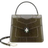 “Serpenti Forever” top handle bag in mimetic jade shiny karung skin. Iconic snakehead closure in light gold plated brass enriched with black and white enamel and green malachite eyes. 289927 image 1