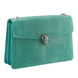 “Serpenti Forever” shoulder bag in emerald green galuchat skin. Iconic snake head closure in light gold plated brass enriched with black enamel, malachite scales and black onyx eyes. 289026 image 2