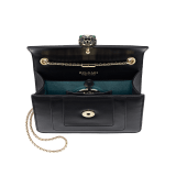 Serpenti Forever small crossbody bag in emerald green calf leather with amethyst purple grosgrain lining. Captivating snakehead closure in light gold-plated brass embellished with black and white agate enamel scales and green malachite eyes. 422-CLa image 4