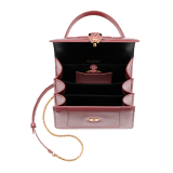 “Serpenti Forever” top handle bag in Blush Quartz pink calf leather with a varnished and pearled effect, and black gros grain internal lining. Tempting snakehead closure in gold plated brass, enriched with matte Blush Quartz pink enamel and black onyx eyes. 290943 image 4