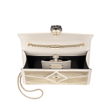 “Serpenti Forever” crossbody bag in black calf leather with a Million Chain motif. Iconic snake head closure in light gold plated brass enriched with black enamel and black onyx eyes. 422-CP image 4