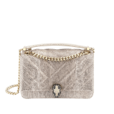 Serpenti Cabochon small shoulder bag in milky opal beige matelassé metallic karung skin with milky opal beige nappa leather lining. Captivating snakehead closure in light gold-plated brass embellished with matt black and glitter milky opal beige enamel scales and black onyx eyes. 1094-MK image 1