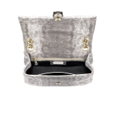 Serpenti Cabochon small shoulder bag in milky opal beige matelassé metallic karung skin with milky opal beige nappa leather lining. Captivating snakehead closure in light gold-plated brass embellished with matt black and glitter milky opal beige enamel scales and black onyx eyes. 1094-MK image 3