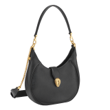 Serpenti Ellipse medium shoulder bag in Urban grain and smooth Niagara sapphire blue calf leather with cloud topaz blue gros grain lining. Captivating snakehead closure in gold-plated brass embellished with black onyx scales and red enamel eyes. 1190-UCL image 2