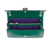 Serpenti Forever medium shoulder bag in black calf leather with emerald green grosgrain lining. Captivating snakehead closure in light gold-plated brass embellished with black and white agate enamel scales and green malachite eyes. 1077-CLa image 4