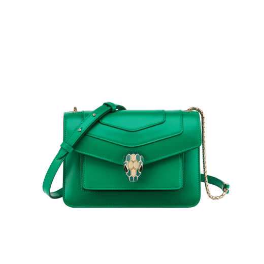 Serpenti Forever small crossbody bag in white agate calf leather with heather amethyst fuchsia grosgrain lining. Captivating snakehead closure in light gold-plated brass embellished with black and white agate enamel scales and green malachite eyes. 1082-CLb image 1
