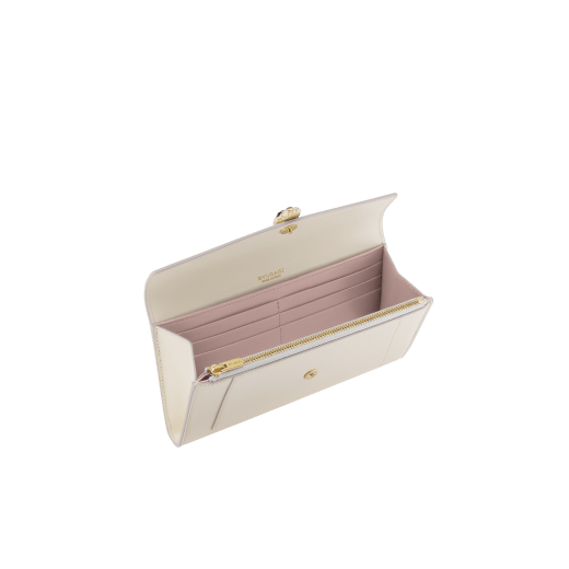 Serpenti Forever large wallet in black calf leather with emerald green nappa leather interior. Captivating snakehead magnetic closure in light gold-plated brass embellished with black enamel and light gold-plated brass scales, and black onyx eyes. SEA-LONG-WLT-R image 2