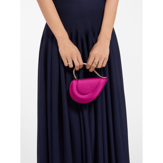 Serpenti Cuoricino mini top handle bag in magenta satin with magenta nappa leather lining. Captivating snake body-shaped top handle in light gold-plated brass embellished with engraved scales; press-button closure. SRN-001-1366XS image 1