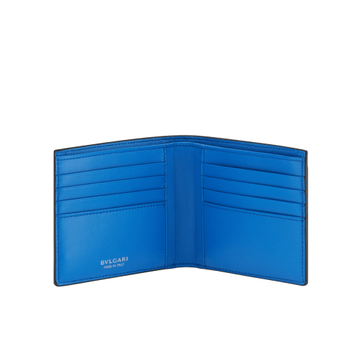 BULGARI BULGARI Man hipster compact wallet in soft, full grain black calf leather with Mediterranean lapis blue nappa leather interior. Iconic palladium-plated brass embellishment with midnight sapphire blue enamel, and folded closure. 293119 image 2