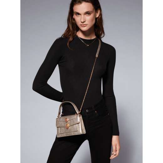 Alexander Wang x Bvlgari belt bag in light gold Molten karung skin with black nappa leather lining. Exclusively redesigned double Serpenti head clasp in antique gold-plated brass with seductive red enamel eyes. 291188 image 8
