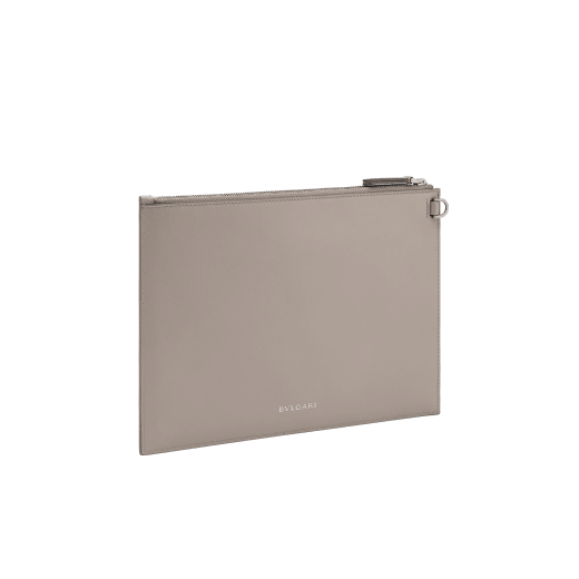 Serpenti Forever pouch in black calf leather with black nappa leather interior. Captivating snakehead rivet in dark ruthenium-plated brass embellished with red enamel eyes. SEA-UNIPOUCH-CL image 4