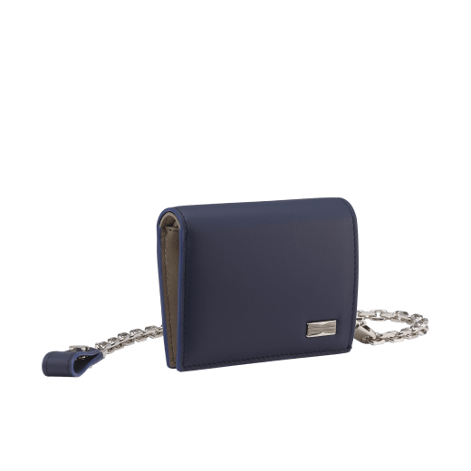 B.zero1 Man compact wallet with chain in black matt calf leather with niagara sapphire blue nappa leather interior. Iconic dark ruthenium and palladium-plated brass embellishment, and folded press-stud closure. BZM-COMPACTWALLET image 1
