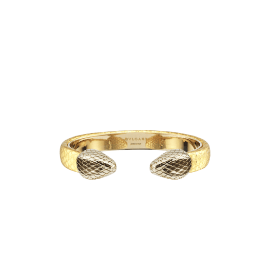 "Serpenti Forever" bangle bracelet in gold "Molten" karung skin. New contraire Serpenti head embellishment in light gold-plated brass, finished with seductive red enamel eyes. SPContr-MoltK-G image 1