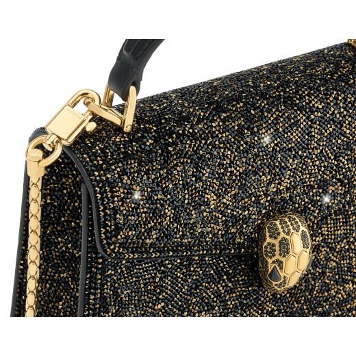 Serpenti Forever mini top handle bag with black crystals inserts hand-set on suede leather and black nappa leather lining. Captivating snakehead magnetic closure in gold-plated brass embellished with black zirconia pavé and gold-plated brass scales, and black onyx eyes. 293890 image 5