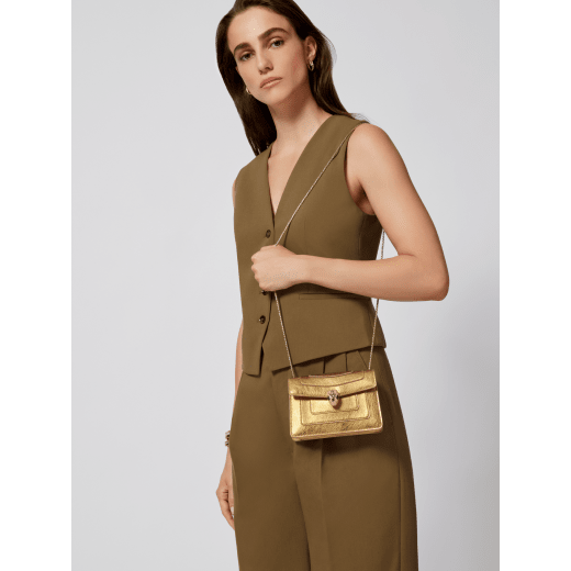 Serpenti Forever mini crossbody bag in deep gold Striated calf leather with crystal rose pink nappa leather lining. Captivating snakehead magnetic closure in light gold-plated brass embellished with beige enamel and light gold-plated brass scales, and black onyx eyes. 293787 image 1