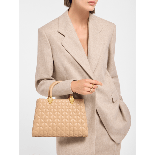 Serpentine Day Duo top handle bag in black calf leather with Calla matelassé motif and black nappa leather lining. Captivating double-head snake body-shaped handles in gold-plated brass embellished with matching calf leather inserts. SRN-001-1315M image 1