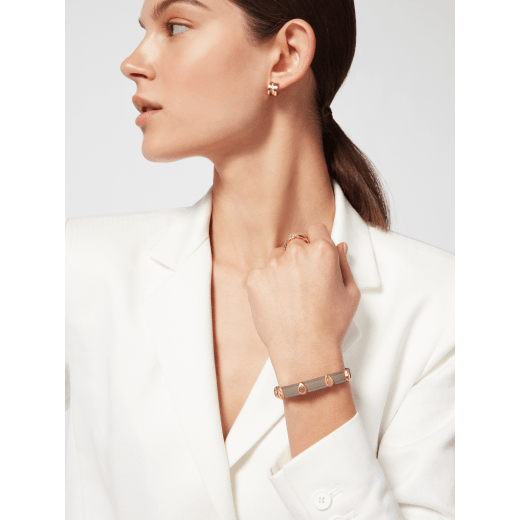 Serpenti Forever bracelet in foggy opal grey calf leather. Multiple captivating snakehead embellishments in gold-plated brass finished with red enamel eyes, and hook-and-eye closure. SER-MULTIHEADS-MCL-FO image 2