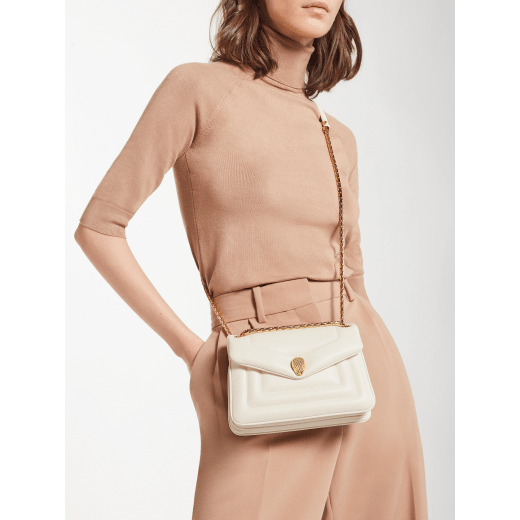 Serpenti Reverse small shoulder bag in ivory opal quilted Metropolitan calf leather with black nappa leather lining. Captivating snakehead magnetic closure in gold-plated brass embellished with red enamel eyes. 1244-MCL image 7