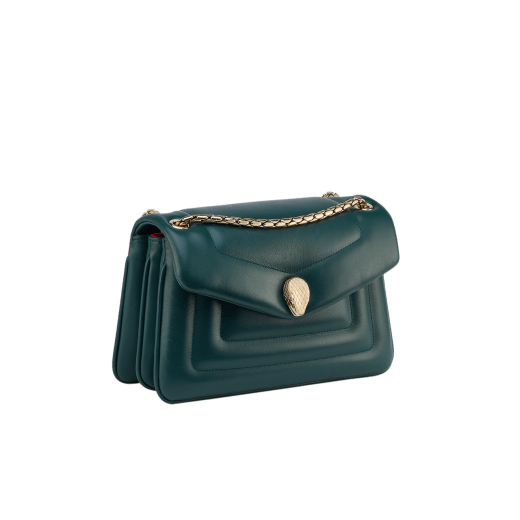Serpenti Reverse small shoulder bag in ivory opal quilted Metropolitan calf leather with black nappa leather lining. Captivating snakehead magnetic closure in gold-plated brass embellished with red enamel eyes. 1244-MCL image 2