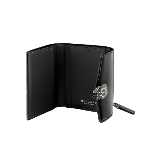 "Serpenti Forever" slim compact wallet in black calf leather and black goatskin. Iconic light gold plated brass snakehead stud closure in black enamel, with black onyx eyes. SEA-SLIMCOMPACT-Cla image 2