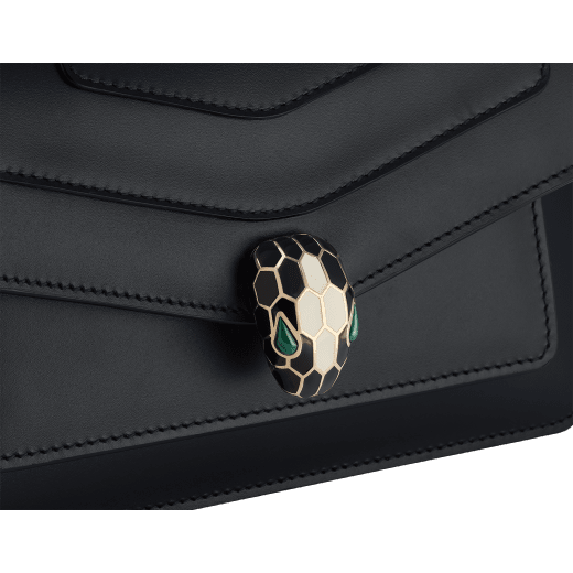 Serpenti Forever East-West small shoulder bag in black calf leather with emerald green gros grain lining. Captivating snakehead magnetic closure in light gold-plated brass embellished with black and white agate enamel scales, and green malachite eyes. 1237-CL image 3