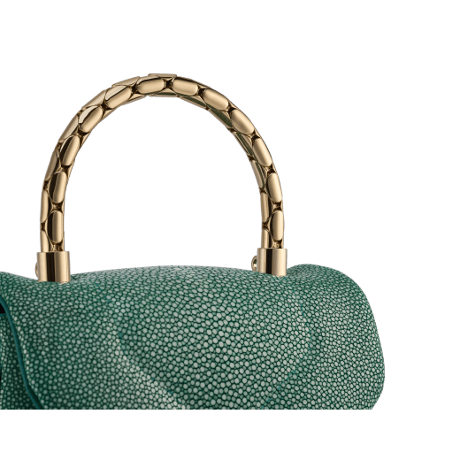 Serpenti Reverse small top handle bag in soft emerald green galuchat skin with amethyst purple nappa leather lining. Captivating magnetic snakehead closure in light gold-plated brass embellished with red enamel eyes. 1234-SG image 7