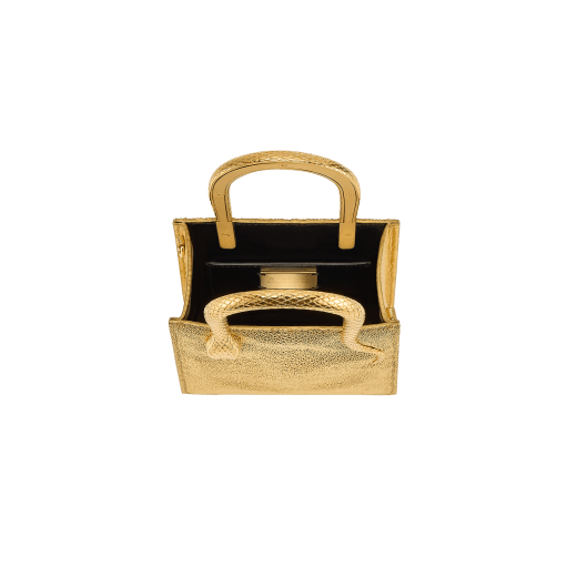 Serpentine mini tote bag in gold galuchat skin with 24 kt gold treatment, shiny gold Mirage nappa leather sides and black nappa leather lining. Captivating snake-shaped handles in gold-plated brass including 3 µ of 24 kt gold, embellished with engraved scales and red enamel eyes. Exclusive Bulgari 50th anniversary in the US Edition. 292705 image 4