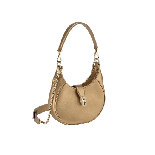 Serpenti Ellipse small crossbody bag in Urban grain and smooth ivory opal calf leather with flamingo quartz pink grosgrain lining. Captivating snakehead closure in gold-plated brass embellished with black onyx scales and red enamel eyes. 1204-UCL image 10