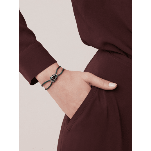 Serpenti Forever bracelet in emerald green fabric. Light gold-plated brass captivating snakehead décor embellished with emerald green and black enamel scales, and black enamel eyes. SERP-STRINGd image 1