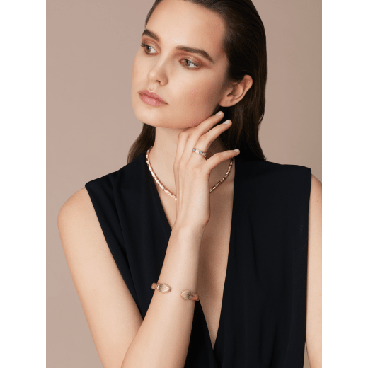 "Serpenti Forever" bangle bracelet in gold "Molten" karung skin. New contraire Serpenti head embellishment in light gold-plated brass, finished with seductive red enamel eyes. SPContr-MoltK-G image 1