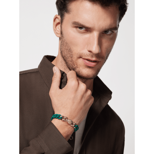Serpenti Forever Maxi Chain bracelet in light gold-plated brass, with partial emerald green enamel. Captivating snakehead embellishment with red enamel eyes in the middle, and adjustable closure. SERP-CHUNKYCHAINb image 4