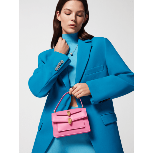 Alexander Wang x Bulgari small belt bag in azalea quartz pink calf leather with black nappa leather lining. Captivating double Serpenti head magnetic closure in antique gold-plated brass embellished with red enamel eyes. 292314 image 6