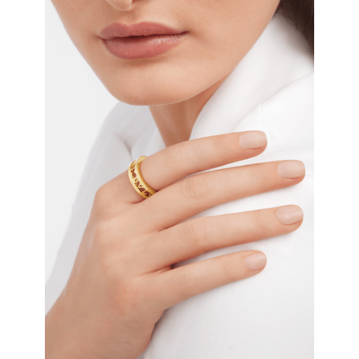B.zero1 couples' rings in 18 kt white and yellow gold with openworked Bulgari logo. A distinctive ring set fusing visionary design with bold charisma. BZERO1-COUPLES-RINGS-4 image 4