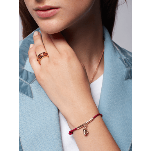 Serpenti Forever bracelet in Niagara sapphire blue fabric and light gold-plated brass tubular element. Eight-pointed star charm and captivating snakehead charm embellished with black and white agate enamel scales and black enamel eyes. SERPSTARSTRING image 2