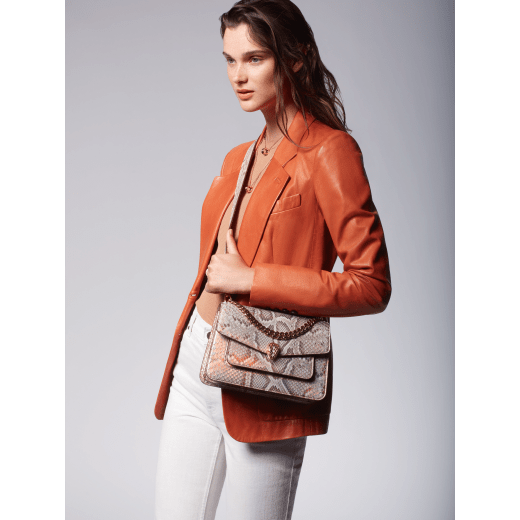 Serpenti Forever Maxi Chain medium crossbody bag in coral carnelian orange Mystical python skin with coral carnelian orange nappa leather lining. Captivating snakehead closure in rose gold-plated brass embellished with mother-of-pearl scales and red enamel eyes. MC-MP-CC image 7
