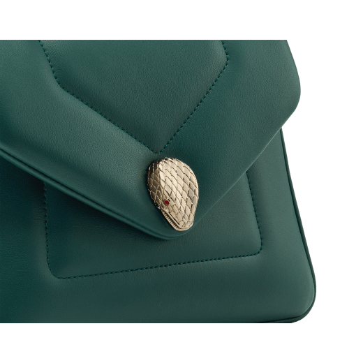Serpenti Reverse small top handle bag in black quilted Metropolitan calf leather with black nappa leather lining. Captivating snakehead magnetic closure in gold-plated brass embellished with red enamel eyes. 1234-MCL image 7