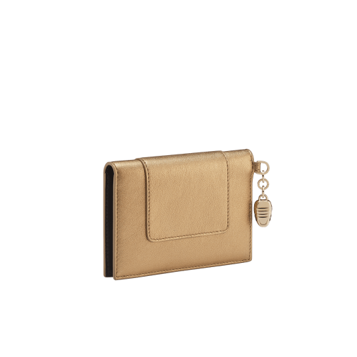 Serpenti Forever folded card holder in coral carnelian orange calf leather with flamingo quartz pink nappa leather interior. Captivating light gold-plated brass snakehead charm with red enamel eyes, and press-stud closure. SEA-CC-HOLDER-FOLD-CLb image 3