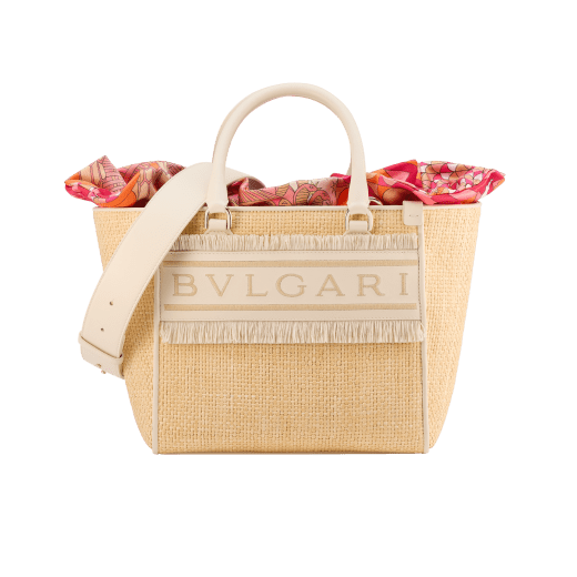 Bulgari Logo medium tote bag in beige raffia with ivory opal calf leather details, beige raffia fringes and beetroot spinel fuchsia nappa leather lining. Iconic Bulgari logo stitched motif, detachable satin satchel with multicolored print outside and beetroot spinel fuchsia inside, and drawstring closure with captivating snakeheads in light gold-plated brass. 292073 image 1