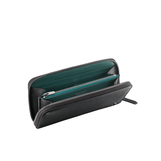 "BVLGARI BVLGARI" men's large zipped wallet in black and Forest Emerald green "Urban" grain calf leather. Iconic logo embellishment in dark ruthenium-plated brass with black enamelling. BBM-WLTZIPASYM image 2